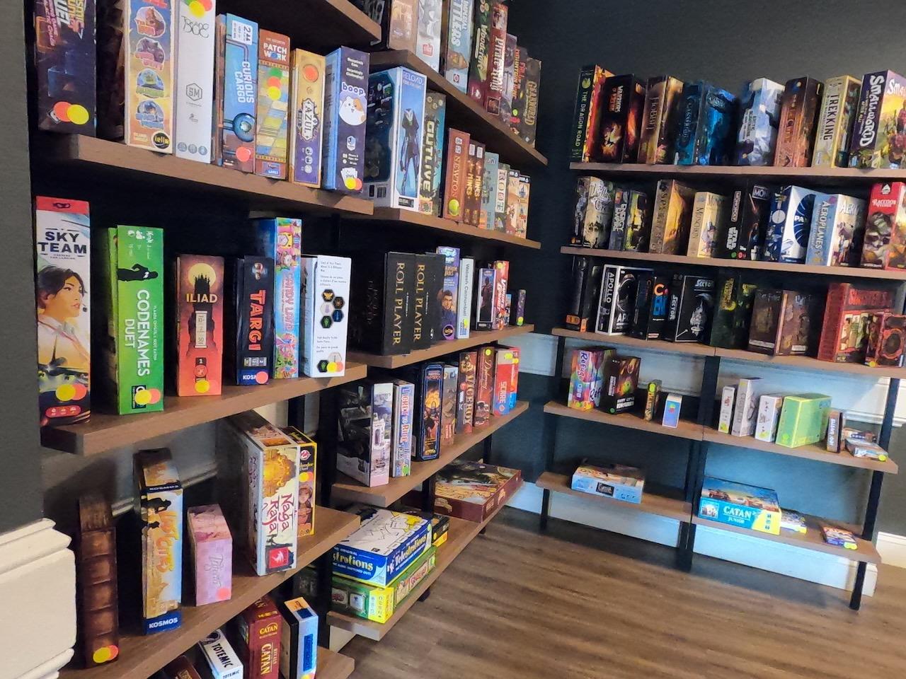 A corner of the café stocked with board games of every kind